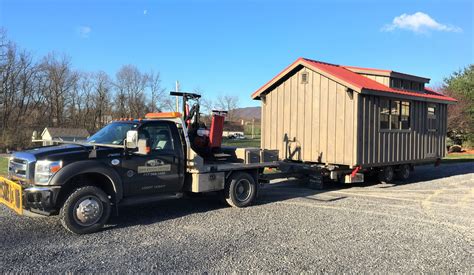 moving a shed with a skid steer|building moving dollies for shed.